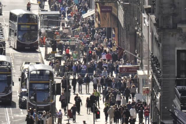 Shoppers are on the move, sending the tills ringing across the high street. Picture: Steven Scott Taylor
