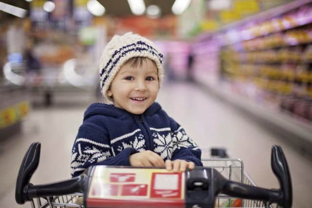 Smiling at a bored toddler in a supermarket can be rewarding. Picture: Getty