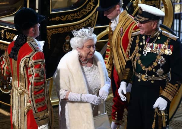 The Queen is accompanied by Prince Phillip on her way to Parliament. Picture: Getty