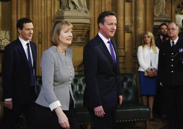 George Osborne, Harriet Harman and David Cameron at the State Opening of Parliament. Picture: Getty