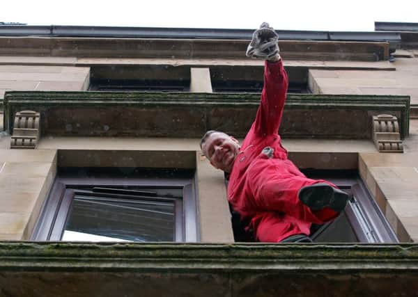Glasgow window cleaner Colin Elliot was pictured by a member of the public balanced on a ledge without safety equipment. Picture: Hemedia
