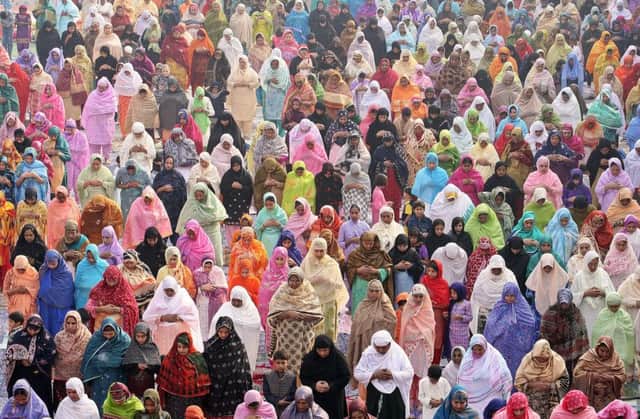 Pakistani Muslim women offer Eid prayers at the historical Badshahi Mosque during the first day of the Eid al-Fitr religious festival in Lahore, Pakistan. Picture: Getty