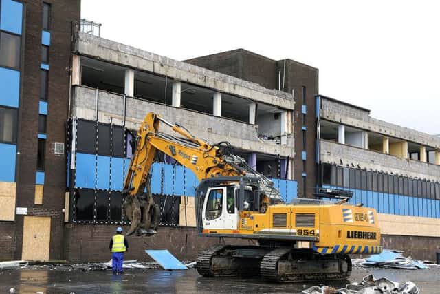 Bulldozers last year knock down Abronhill High School, which featured in Gregorys Girl. Picture: Michael Gillen