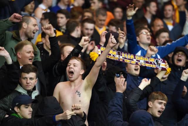 Motherwell fans celebrate beating Rangers in the first-leg of their Scottish Premiership play-off final. Picture: SNS