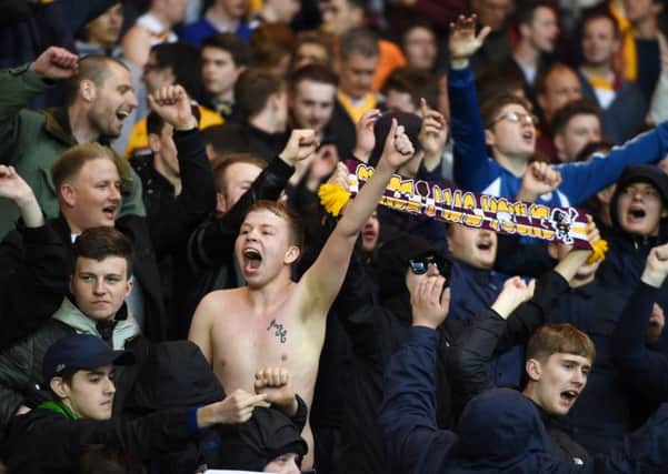 Motherwell fans celebrate beating Rangers in the first-leg of their Scottish Premiership play-off final. Picture: SNS