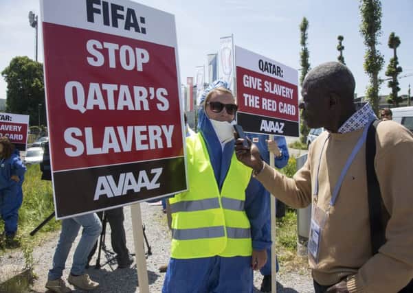 Protesters against Qatars treatment of migrant workers gather outside Fifas meeting in Switzerland last week. Picture: AP