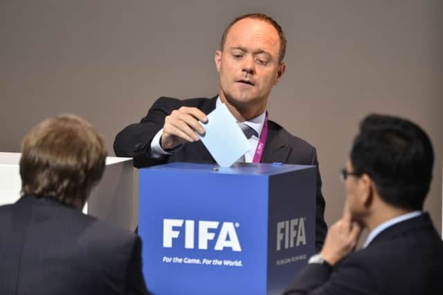 The Netherlands delegate casts his ballot in the vote to decide on the Fifa presidency. Picture: AFP/Getty Images