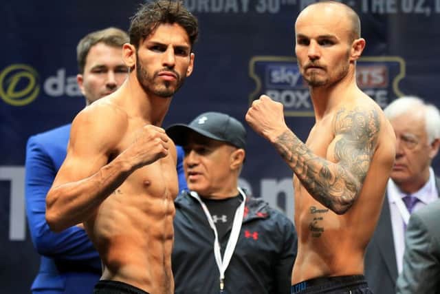 Kevin Mitchell and Jorge Linares square up at the weighin yesterday. Picture: PA