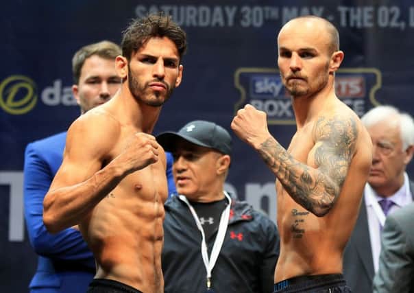 Kevin Mitchell and Jorge Linares square up at the weighin yesterday. Picture: PA