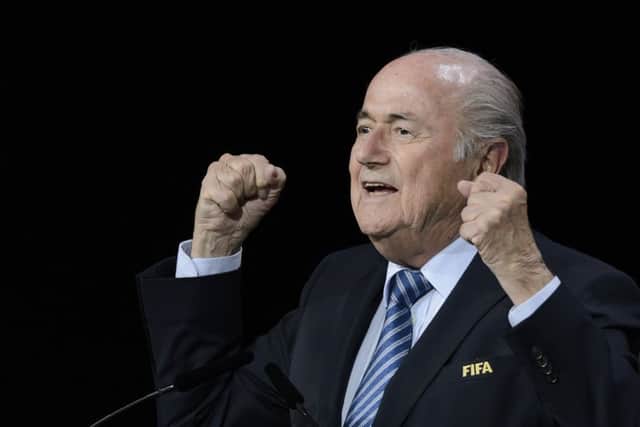 Sepp Blatter reacts after being re-elected yesterday. Picture: Getty