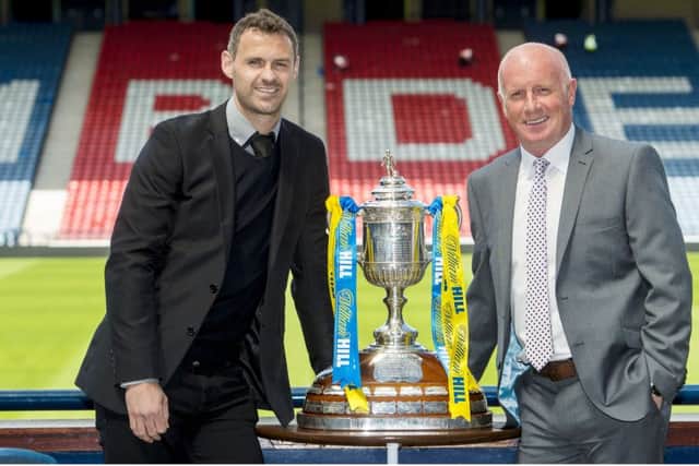 Falkirk's David McCracken (left) joins manager Peter Houston. Picture: Steve Welsh