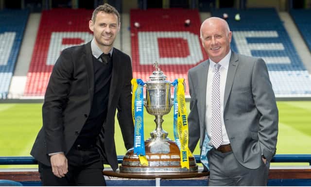 Falkirk's David McCracken (left) joins manager Peter Houston. Picture: Steve Welsh
