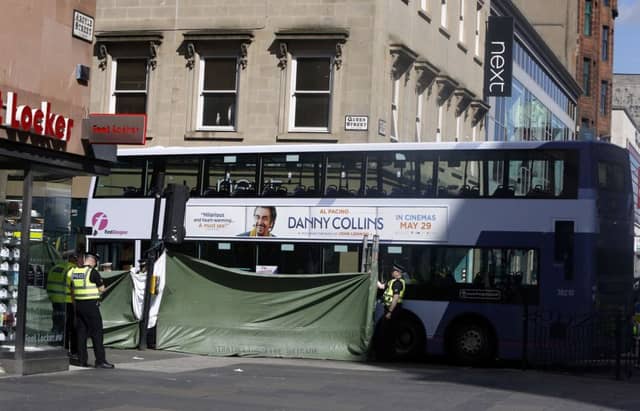 Police attend the scene of an accident on the corner of Queen Street and Argyle Street in Glasgow. Picture: PA