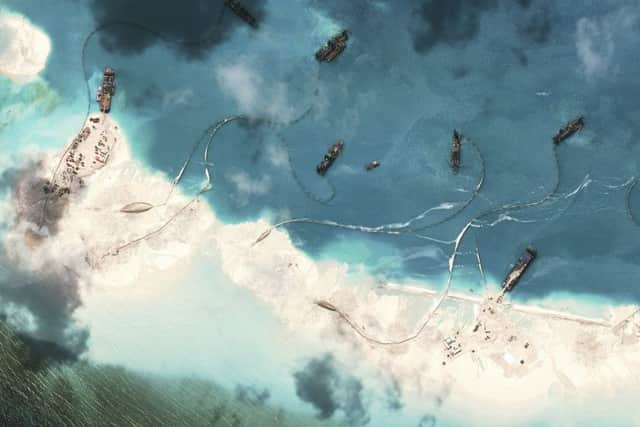 A  satellite image shows dredgers working at the northernmost reclamation site of Mischief Reef. Picture: Contributed