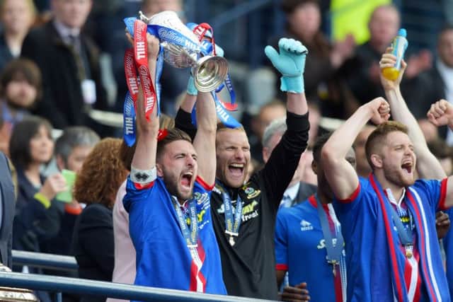 Inverness CT captain Graeme Shinnie celebrates with the trophy. Picture: SNS