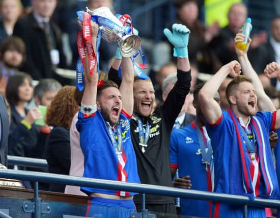 Inverness CT captain Graeme Shinnie celebrates with the trophy. Picture: SNS