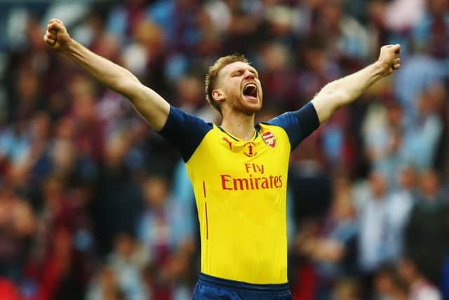 Per Mertesacker celebrates scoring Arsenal's third. Picture: Getty