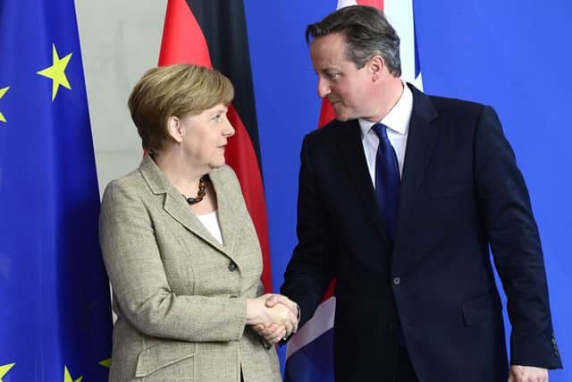 German Chancellor Angela Merkel and British Prime Minister David Cameron shake hands at the end of their meeting over the EU. Picture: Getty