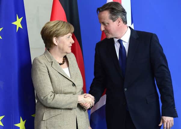 German Chancellor Angela Merkel and British Prime Minister David Cameron shake hands at the end of their meeting over the EU. Picture: Getty
