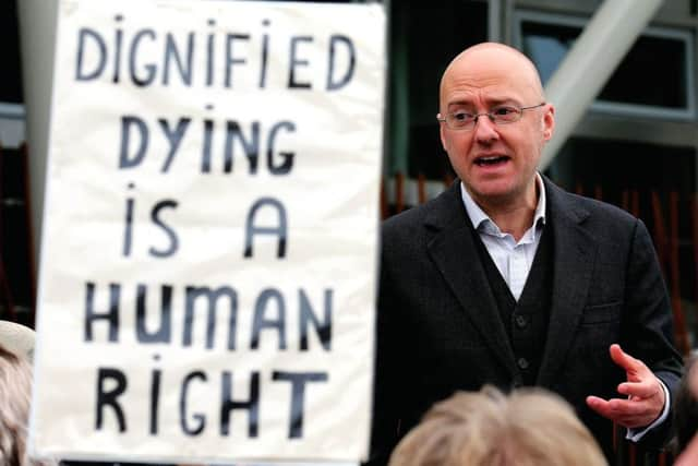 Assisted Suicide Bill supporter Patrick Harvie, speaks with representatives of My Life, My Death, My Choice, outside the Scottish Parliament. Picture: TSPL