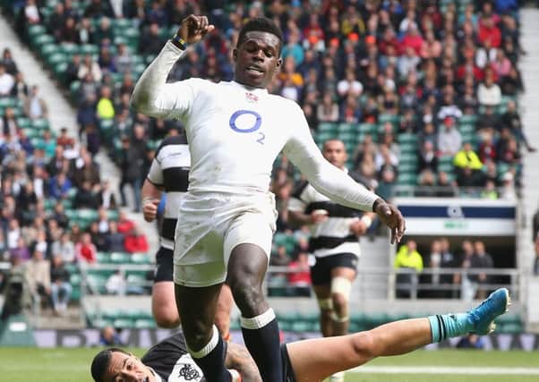 Christian Wade, of England, breaks clear of Tusi Pisi at Twickenham. Picture: Getty