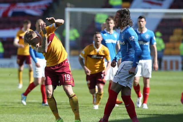 Rangers player Bilel Mohsni and Motherwell's Lee Erwin clash after the Scottish Premiership Play Off Final. Picture: PA
