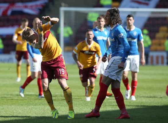 Rangers player Bilel Mohsni and Motherwell's Lee Erwin clash after the Scottish Premiership Play Off Final. Picture: PA