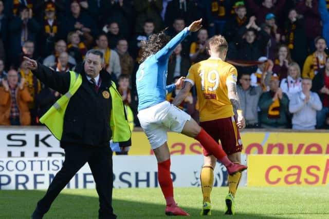 Rangers' Bilel Mohsni clashes with Lee Erwin. Picture: SNS