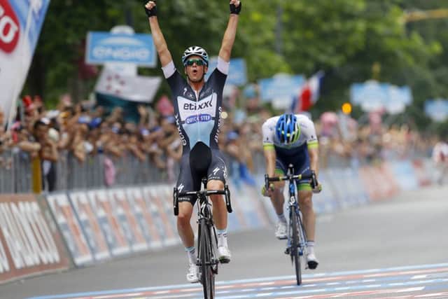 Iljo Keisse celebrates as he holds off Luke Durbridge to win yesterdays final stage