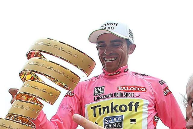 A victorious Alberto Contador with his team and Oleg Tinkov. Picture: AFP/Getty