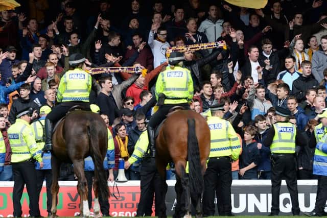 Mounted police officers were used to control the crowd at full-time. Picture: SNS