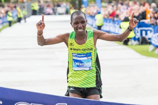 Peter Wanjiru of Kenya reaches the finishing line after fighting the elements to win the Edinburgh Marathon. Picture: Ian Georgeson