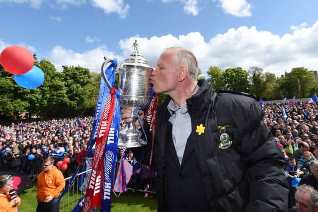 ICT manager John Hughes is the proudest man in Inverness as he shows off the Scottish Cup. Picture: SNS