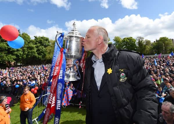 ICT manager John Hughes is the proudest man in Inverness as he shows off the Scottish Cup. Picture: SNS