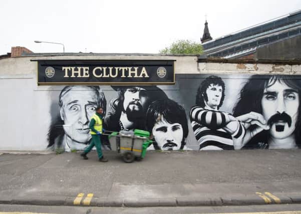 Clutha Vaults mural of famous customers being painted by Bobby McNamara aka Rogue One. Picture: John Devlin