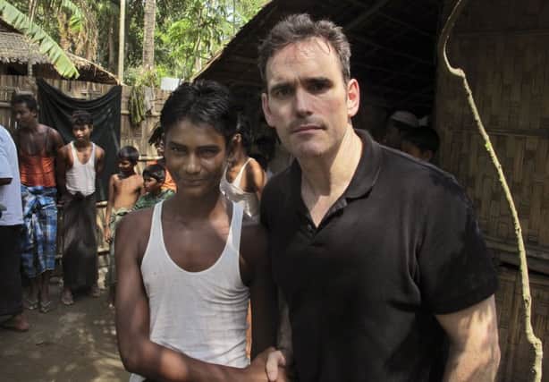 Hollywood actor Matt Dillon with Noor Alam, a 17year old Rohingya survivor of human trafficking at Thetkabyin village in Myanmar. Picture: AP