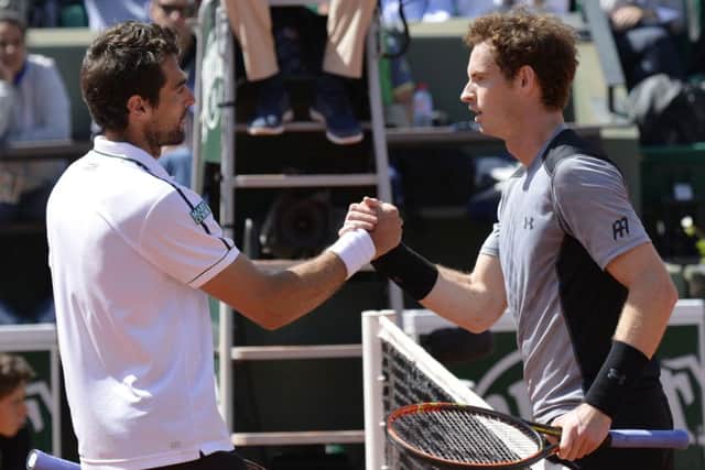 Andy Murray shakes hands with France's Jeremy Chardy at the end of their men's fourth round match at the Roland Garros 2015 French Tennis Open in Paris. Picture: Getty