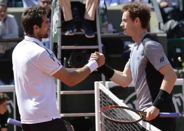 Andy Murray shakes hands with France's Jeremy Chardy at the end of their men's fourth round match at the Roland Garros 2015 French Tennis Open in Paris. Picture: Getty