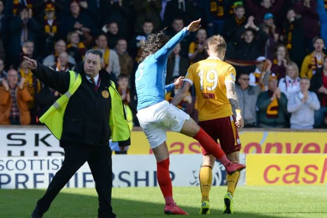 Bilel Mohsni kicks out at Lee Erwin. Picture: SNS