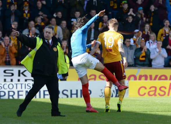 Bilel Mohsni kicks out at Lee Erwin. Picture: SNS