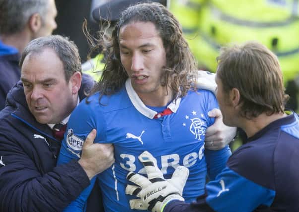 Bilel Mohsni is taken off the pitch after the scuffle. Picture: Getty