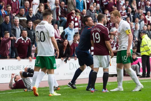 Tempers flared at Tynecastle last season between Liam Craig (right) and James Keatings. Picture: SNS