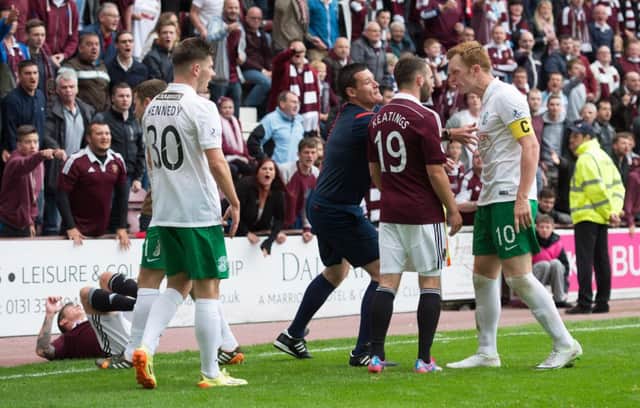 Tempers flared at Tynecastle last season between Liam Craig (right) and James Keatings. Picture: SNS
