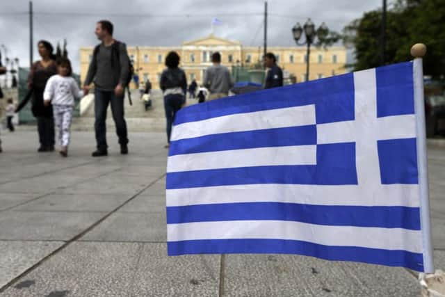 Concerns ahead of a payment deadline for Greece left Londons blue-chip share index lower. Picture: AP