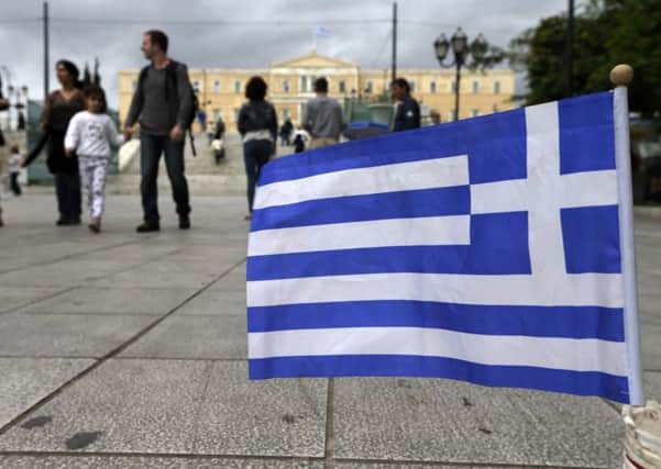 Concerns ahead of a payment deadline for Greece left Londons blue-chip share index lower. Picture: AP