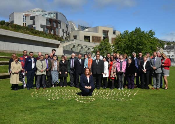 Anne McTaggart with transplant recipients outside the Scottish Parliament yesterday. Picture: Jon Savage