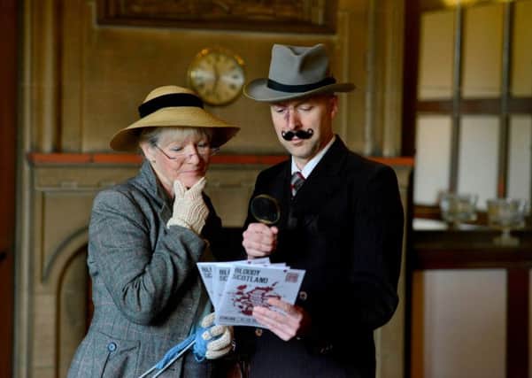 Crime writers Alex Gray and Christopher Brookmyre dress up as Miss Marple and Hercule Poirot to launch Bloody Scotland. Picture: Hemedia