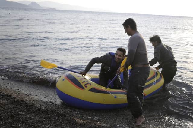 Migrants from Pakistan land with their dinghy at Kos island after crossing a part of the Aegean Sea from Turkey to Greece, Tuesday, June 2, 2015. Picture: AP