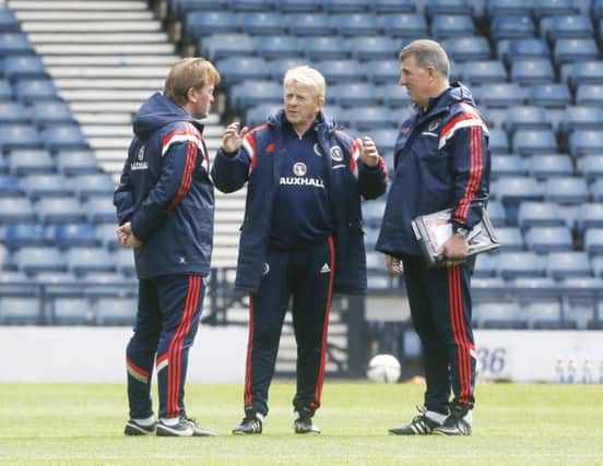 Gordon Strachan talks to coaches Stuart Mccall (left) and Mark McGhee (right) at Hampden Park. Picture: PA
