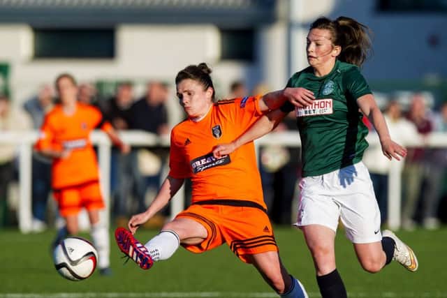 Glasgows Joanne Love and Hibs Chloe Arthur  battle for possession. Picture: SNS